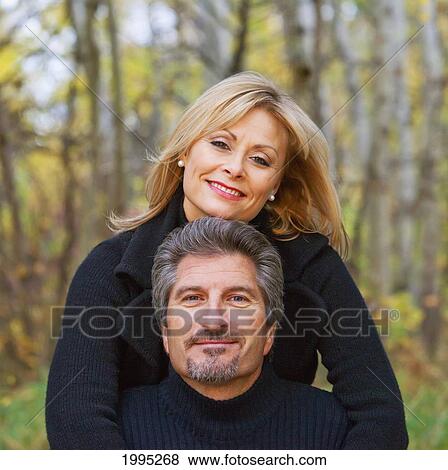 Portrait Of A Couple In A Park In Autumn; St. Albert Alberta Canada View Large Photo Image Stock Photo - Portrait Of A Couple In A Park In Autumn; St. Albert Alberta Canada. Fotosearch