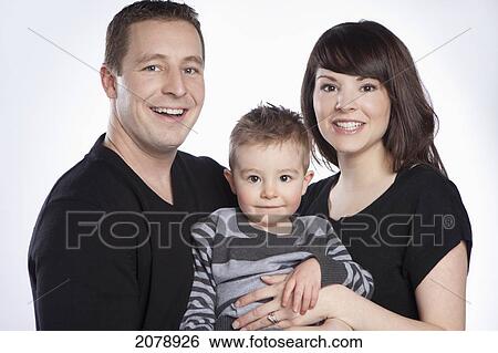 Stock Photograph - Portrait of a family with a young son; edmonton alberta canada. Fotosearch