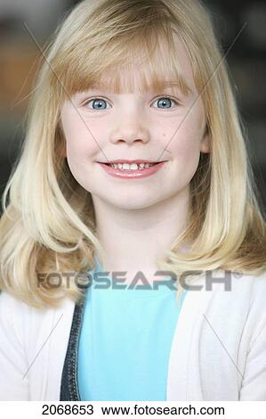 Stock Image - Portrait Of A Girl With Blond Hair And Blue Eyes; Troutdale Oregon United States Of America. Fotosearch