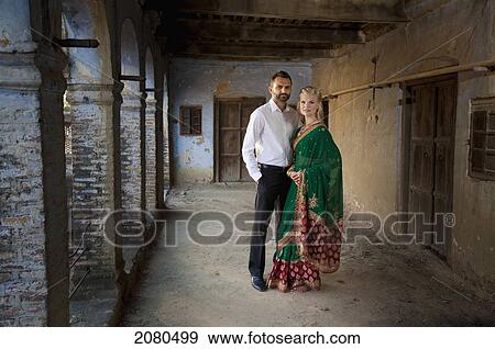 Portrait of a mixed race couple her wearing a sari; ludhiana punjab india View Large Photo Image Stock Photo - Portrait of a mixed race couple her wearing a sari; ludhiana punjab india. Fotosearch