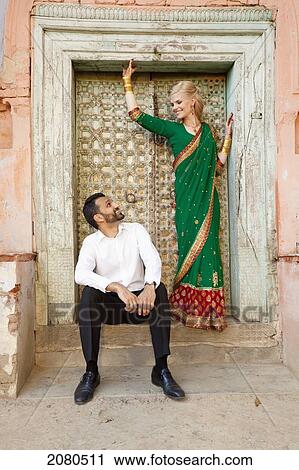 Portrait of a mixed race couple in a doorway with her wearing a sari; ludhiana punjab india View Large Photo Image Stock Image - Portrait of a mixed race couple in a doorway with her wearing a sari; ludhiana punjab india. Fotosearch