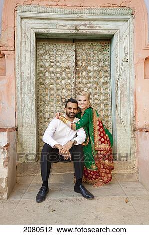 Portrait of a mixed race couple in a doorway with her wearing a sari; ludhiana punjab india View Large Photo Image Stock Image - Portrait of a mixed race couple in a doorway with her wearing a sari; ludhiana punjab india. Fotosearch