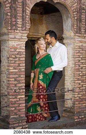 Stock Photo - Portrait of a mixed race couple with her wearing a sari; ludhiana punjab india. Fotosearch