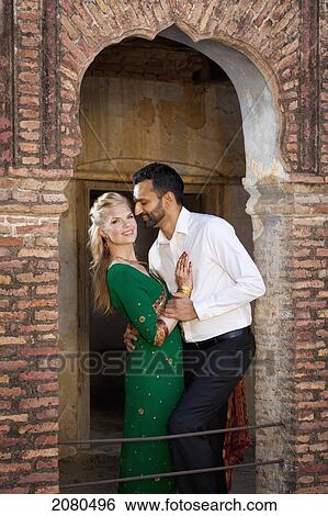 Stock Photograph - Portrait of a mixed race couple with her wearing a sari; ludhiana punjab india. Fotosearch