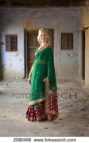 Stock Photo - Portrait of a woman in a sari; ludhiana punjab india. Fotosearch