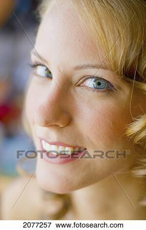 Stock Photo - Portrait of a woman with blond hair and blue eyes; vancouver british columbia canada. Fotosearch