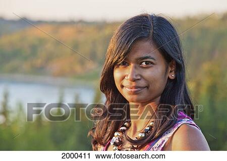 Stock Image - Portrait Of A Young East Indian Woman; Edmonton Alberta Canada. Fotosearch