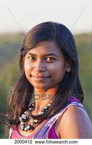 Stock Image - Portrait Of A Young East Indian Woman; Edmonton Alberta Canada. Fotosearch