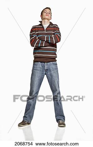 Portrait Of A Young Man Standing With Arms Crossed; Manitou Springs Colorado United States Of America View Large Photo Image Picture - Portrait Of A Young Man Standing With Arms Crossed; Manitou Springs Colorado United States Of America. Fotosearch