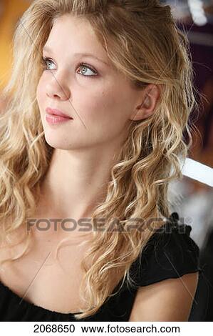 Portrait Of A Young Woman With Blond Hair And Green Eyes; Troutdale Oregon United States Of America View Large Photo Image Stock Image - Portrait Of A Young Woman With Blond Hair And Green Eyes; Troutdale Oregon United States Of America. Fotosearch