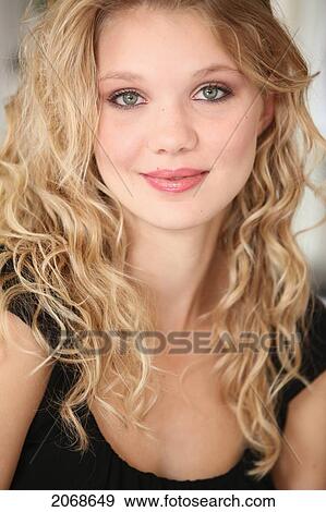 Portrait Of A Young Woman With Blond Hair And Green Eyes; Troutdale Oregon United States Of America View Large Photo Image Stock Photo - Portrait Of A Young Woman With Blond Hair And Green Eyes; Troutdale Oregon United States Of America. Fotosearch