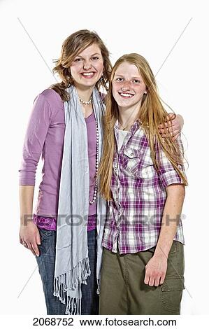 Portrait Of Two Young Women Against A White Background; Manitou Springs Colorado United States Of America View Large Photo Image Stock Image - Portrait Of Two Young Women Against A White Background; Manitou Springs Colorado United States Of America. Fotosearch