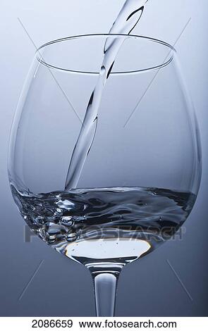 Pouring water into a glass; tarifa cadiz andalusia spain View Large Photo Image Stock Photo - Pouring water into a glass; tarifa cadiz andalusia spain. Fotosearch