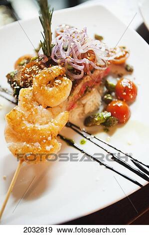 Stock Photo - Prawn On A Skewer And Tuna Fish Presented On A White Plate; Coolangatta Queensland Australia. Fotosearch
