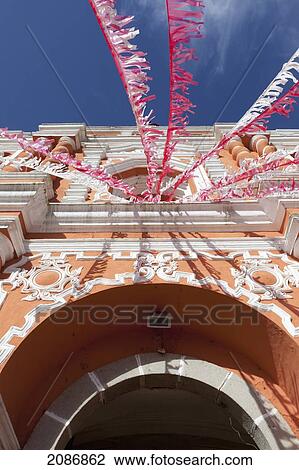 Red and white streamers hung over an arched doorway; guatemala city guatemala View Large Photo Image Stock Image - Red and white streamers hung over an arched doorway; guatemala city guatemala. Fotosearch
