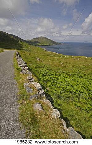 Stock Image - Road Winding Round The Coastline Of The Beara Peninsula In West Cork; County Cork Ireland. Fotosearch