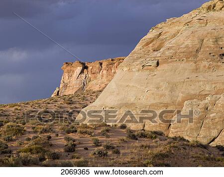 Stock Photography - Rock Cliffs And Dark Clouds In The Sky; Utah United States Of America. Fotosearch