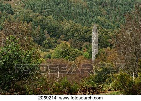 Picture - Round Tower In A Forest; Ireland. Fotosearch