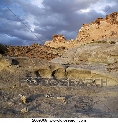 Stock Photo - Rugged Rock Formation And Cliffs On A Desert Landscape; Utah United States Of America. Fotosearch