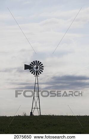Silhouette Of An Old Wind Mill In A Field With Clouds East Of Red Deer; Alberta Canada View Large Photo Image Stock Image - Silhouette Of An Old Wind Mill In A Field With Clouds East Of Red Deer; Alberta Canada. Fotosearch
