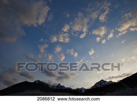 Silhouette of the canadian rocky mountains at sunset; nordegg alberta canada View Large Photo Image Stock Image - Silhouette of the canadian rocky mountains at sunset; nordegg alberta canada. Fotosearch
