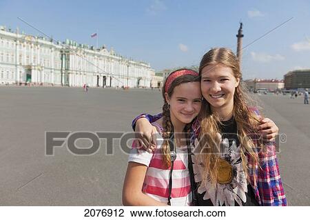 Sisters in an embrace with winter palace in the background; st. petersburg russia View Large Photo Image Stock Image - Sisters in an embrace with winter palace in the background; st. petersburg russia. Fotosearch
