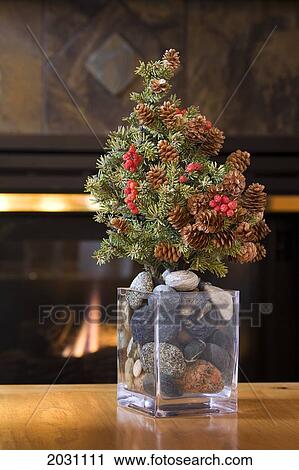 Small Real Fur Tree Decorated With Cones And Red Berries