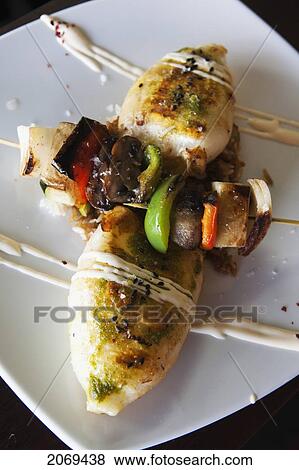 Squid And Vegetable Skewer In A Formal Presentation On A White Plate; Kirra Gold Coast Queensland Australia View Large Photo Image Stock Photo - Squid And Vegetable Skewer In A Formal Presentation On A White Plate; Kirra Gold Coast Queensland Australia. Fotosearch