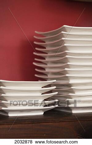 Stock Photo - Stacks Of White Plates On A Shelf; Coolangatta Queensland Australia. Fotosearch