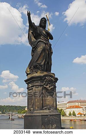 Stock Photo - Statue Of St. John The Baptist On Charles Bridge Or Karluv Most; Prague Hlavni Mesto Praha Czech Republic. Fotosearch