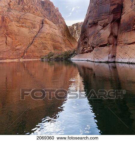 Steep Rock Cliffs Along The Shoreline Reflected In The Colorado River; Arizona United States Of America View Large Photo Image Stock Image - Steep Rock Cliffs Along The Shoreline Reflected In The Colorado River; Arizona United States Of America. Fotosearch