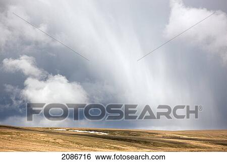 Streaks of storm clouds in the sky above a field; swaledale england View Large Photo Image Stock Photograph - Streaks of storm clouds in the sky above a field; swaledale england. Fotosearch