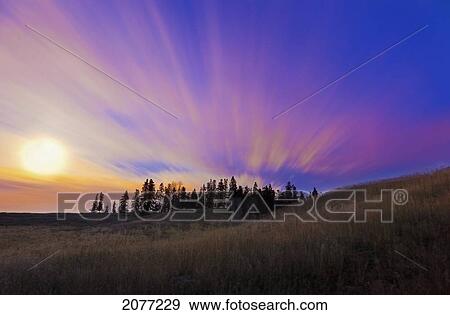 Streaks through the clouds at sunset; parkland county alberta canada View Large Photo Image Stock Photo - Streaks through the clouds at sunset; parkland county alberta canada. Fotosearch