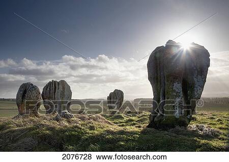 Sunlight shining on the standing stones of duddo; northumberland england View Large Photo Image Stock Photo - Sunlight shining on the standing stones of duddo; northumberland england. Fotosearch