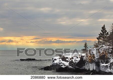 Stock Image - Sunset over lake superior; thunder bay ontario canada. Fotosearch