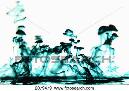 Stock Photo - Swirls of blue and black liquid mixing; edmonton alberta canada. Fotosearch