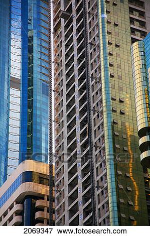 Stock Photo - Tall Buildings With Windows And Balconies In An Urban Area; Dubai United Arab Emirates. Fotosearch
