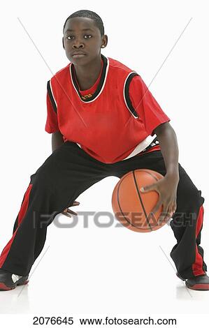 Teenage boy in red jersey bouncing basketball; portland oregon united states of america View Large Photo Image Stock Photography - Teenage boy in red jersey bouncing basketball; portland oregon united states of america. Fotosearch
