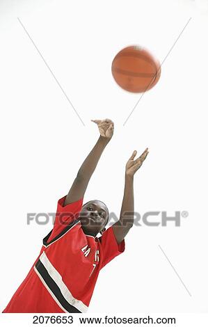 Teenage boy wearing red jersey and shooting basketball; portland oregon united states of america View Large Photo Image Stock Image - Teenage boy wearing red jersey and shooting basketball; portland oregon united states of america. Fotosearch