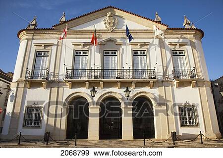 Stock Photo - The Front Of A Building With Flags Lining The Balcony; Faro Algarve Portugal. Fotosearch