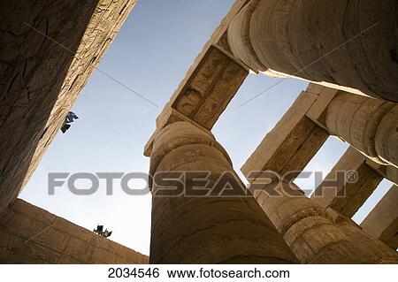 Stock Photograph - The Massive Columns In The Temples Of Karnak On The East Bank Of Luxor Along The Nile River; Luxor Egypt. Fotosearch