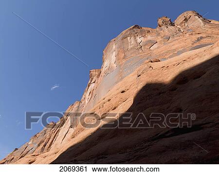 Top Of A Rock Cliff Against A Blue Sky; Arizona United States Of America View Large Photo Image Stock Image - Top Of A Rock Cliff Against A Blue Sky; Arizona United States Of America. Fotosearch