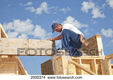 Picture - Tradesman Working On Framing For New Home Construction; St. Albert Alberta Canada. Fotosearch