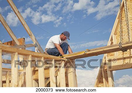 Tradesman Working On Framing For New Home Construction; St. Albert Alberta Canada View Large Photo Image Stock Image - Tradesman Working On Framing For New Home Construction; St. Albert Alberta Canada. Fotosearch