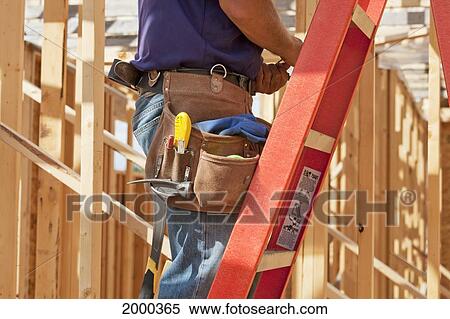 Tradesman Working On Framing For New Home Construction; St. Albert Alberta Canada View Large Photo Image Stock Photography - Tradesman Working On Framing For New Home Construction; St. Albert Alberta Canada. Fotosearch