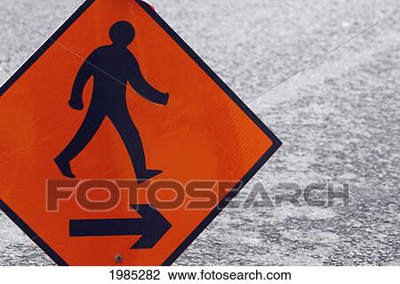 Stock Image - Traffic Sign Advising Pedestrians To Walk To The Right; Dunmanway County Cork Republic Of Ireland. Fotosearch