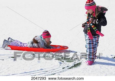 Two Girls Playing In The Snow; Troutdale Oregon United States Of America View Large Photo Image Stock Image - Two Girls Playing In The Snow; Troutdale Oregon United States Of America. Fotosearch