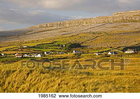 Stock Image - View Of Fanore Village And Limestone Mountain In The Background In The Burren Region; County Clare Ireland. Fotosearch