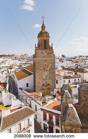 Stock Photo - View over town centre to church of san bartolome; carmona seville province spain. Fotosearch