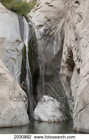 Waterfalls Along Rounded Cliff Rock In The Desert; Palm Springs California United States Of America View Large Photo Image Stock Image - Waterfalls Along Rounded Cliff Rock In The Desert; Palm Springs California United States Of America. Fotosearch